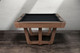 Front view of the Gracy slate pool table with angular base and clean apron lines, designed by Doc & Holliday Front view of the Gracy slate pool table with angular base and clean apron lines, designed by Doc & Holliday